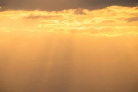 Sunset sky with clouds over calm water Stock Photos