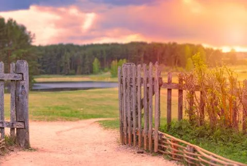 Sunset sky with clouds over forest and river. Stock Photos
