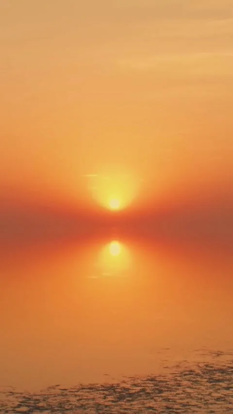 Sunset sky Clouds over sea in the Evening with Orange (Vertical) Stock Footage 297560390