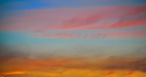 Sunset sky clouds in red orange Stock Photos