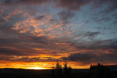 Sunset sky clouds. Sky clouds in the sunset. Stock Photos