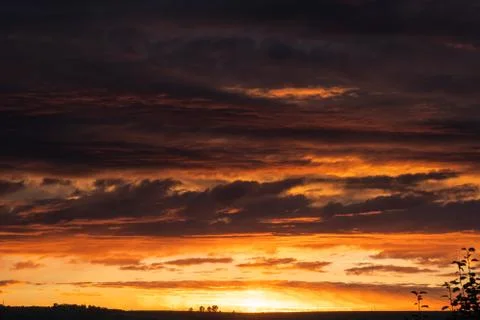 Sunset sky clouds. Sky clouds in the sunset. Stock Photos
