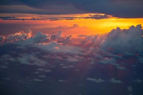 Sunset Sky Dance Above the Clouds 库存照片