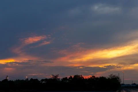 Sunset Sky with Dramatic Clouds and Colors in Twilight Evening Фото