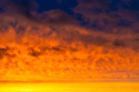 Sunset sky, dramatic clouds on colorful sky Stock Photos