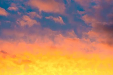 Sunset sky, dramatic clouds on colorful sky Stock Photos