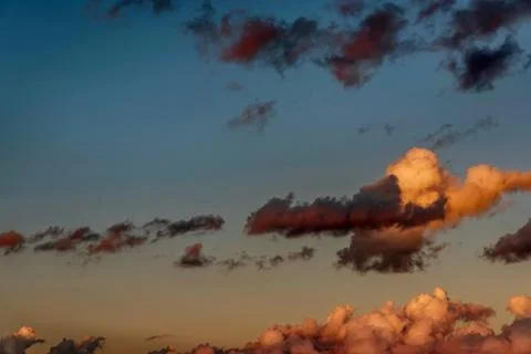 Sunset sky with dramatic orange clouds Stock Photos