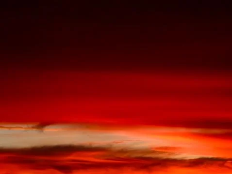 Sunset Sky with Dramatic Red Clouds and Dark Horizon Abstract Orange Gradient Stock Photos