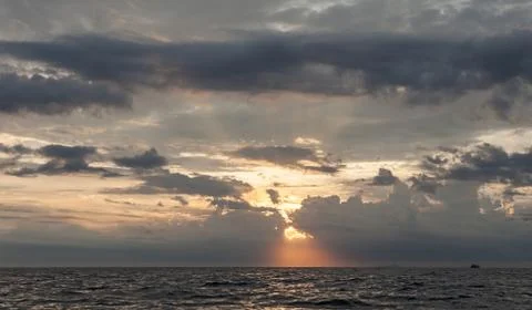 Sunset sky with dramatic stormy clouds. Stock Photos