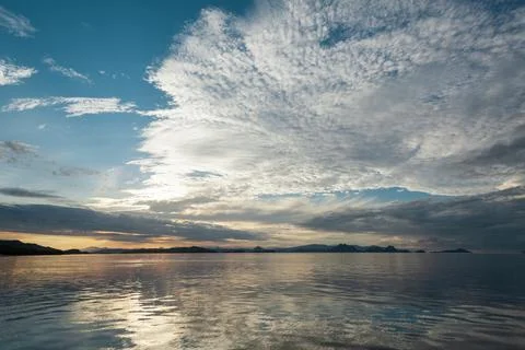 Sunset sky filled with cirrocumulus clouds Stock Photos