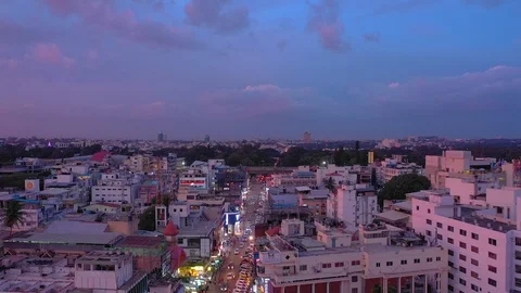 Sunset sky flight over bangalore city traffic street aerial panorama 4k india Stockbeeldmateriaal 104376835