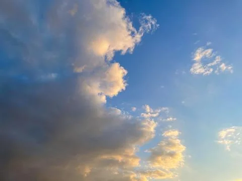 Sunset sky with fluffy clouds, morning or down time of day. Stock Photos