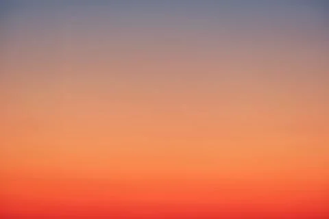 Sunset sky gradient with colors from orange to red Stock Photos