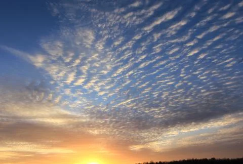 Sunset sky with interesting small cloud texture top half Foto stock