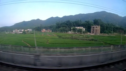 Sunset sky landscape scene view from inside high speed train. 스톡 동영상 118789597