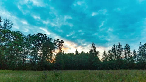 Sunset sky in motion, 4k timelapse landscape with meadow Stock Footage 314007834