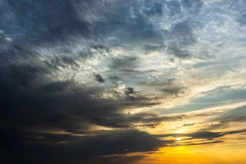 Sunset sky with multicolor clouds. Dramatic twilight sky background Stock Photos
