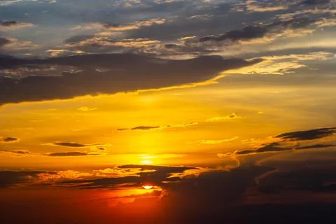 Sunset sky with multicolor clouds. Dramatic twilight sky background Stock Photos