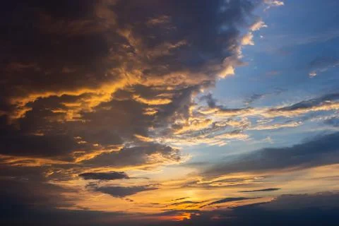 Sunset sky with multicolor clouds. Dramatic twilight sky background Stock Photos