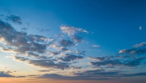 Sunset sky with multicolor clouds Stock Photos
