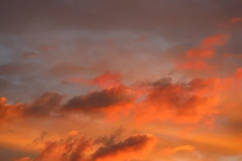 Sunset sky. orange light on the clouds Stock Photos