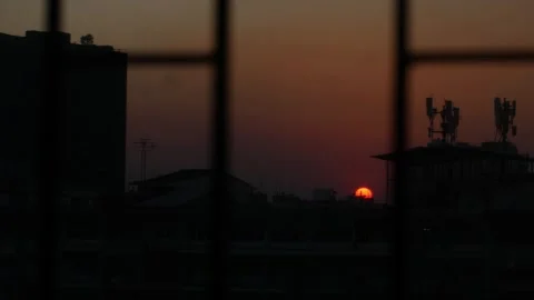 Sunset sky over city skyline with communication towers Stock Footage 325760950