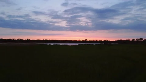 Sunset Sky over Field and River. Warm Summer Evening. Aerial View. Stock Footage 155784493