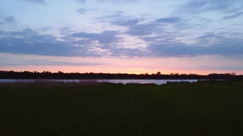 Sunset Sky over Field and River. Warm Summer Evening. Aerial View. Stock Footage 155784719