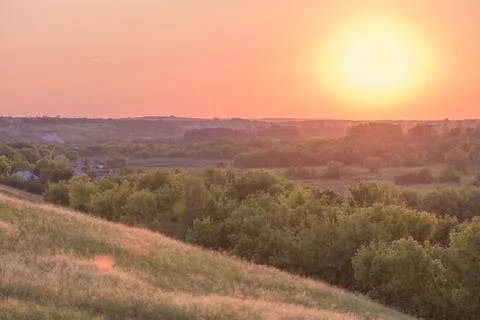 Sunset sky over the fields. pink sky. landscape at sunset. Stock Photos
