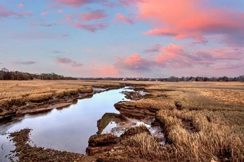 Sunset sky over the marsh and Sesuit Creek in East Dennis in winter Stock Photos