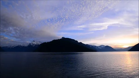 Sunset sky over the mountains. Landscape in the Alpine lake. Stock Footage 73590626
