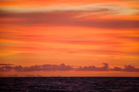 Sunset sky over the ocean Stock Photos