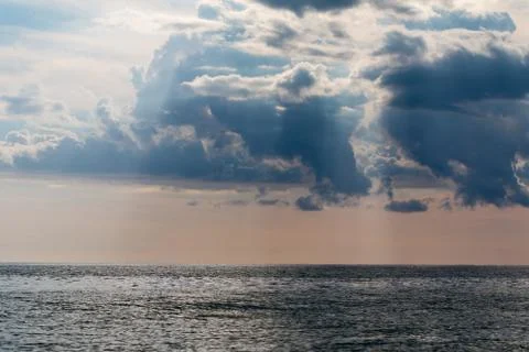 Sunset sky over ocean Stock Photos