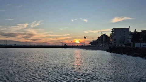 Sunset sky over seaside town Stock Footage 300308481