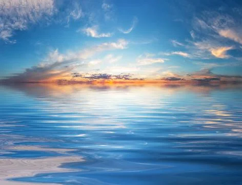Sunset sky over water surface Foto stock