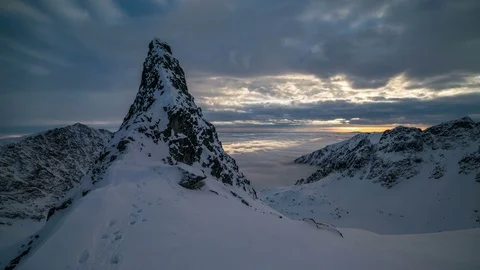 Sunset sky ower winter mountain peak Stock Footage 84931953