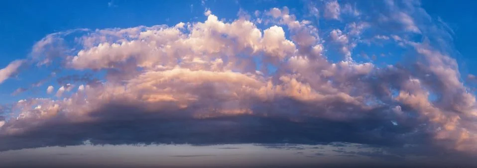 Sunset sky panorama with clouds. Stock Photos