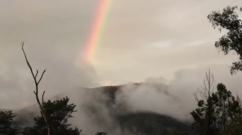 Sunset sky with rainbow, Australian hill landscape Stock Footage 45158255