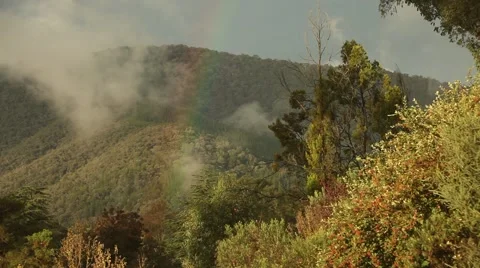 Sunset sky with rainbow, Australian hill landscape Stock Footage 45158481