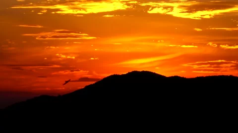 Sunset sky in red and yellow colors above sea shore. Видео 154735957