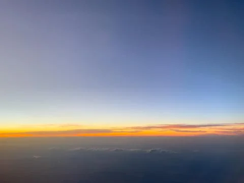 Sunset sky stratosphere background, pictured from plane. Stock Photos