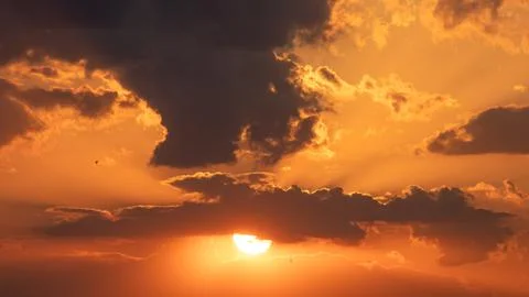 Sunset sky with stunning clouds in the background. Horizontal banner, story. Stock Photos