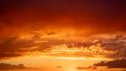 Sunset sky with stunning clouds in the background. Horizontal banner, story. Stock Photos