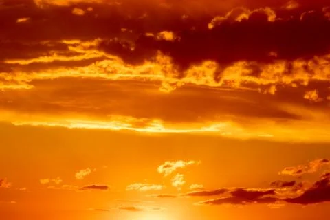 Sunset sky with stunning clouds in the background. Horizontal banner, story. Stock Photos