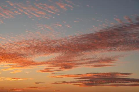 Sunset sky texture background. Cloudscape. Orange texture of clouds. Sunrise Photos