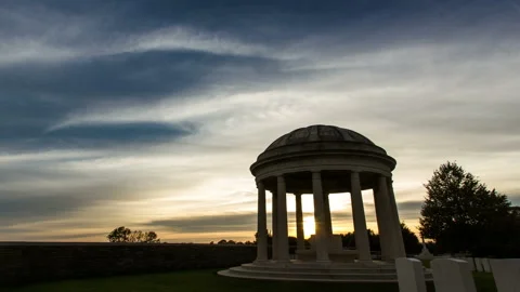 Sunset sky timelapse with high clouds above a british war cemetery Stock Footage 97918303