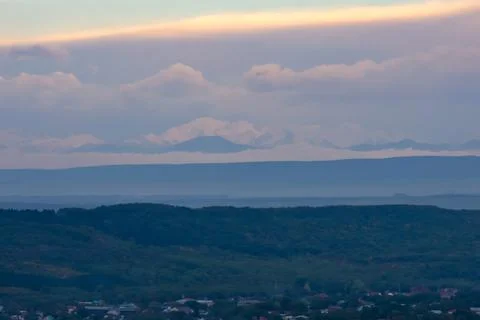 Sunset sky. View from Mount Mashuk to the top of Mount Elbrus. Russia. Nort.. Stock Photos