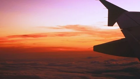 Sunset sky view through airplane window  Stock Footage 89653947
