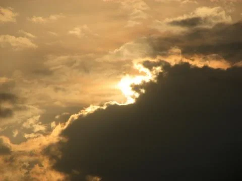 Sunset in the sky,clouds and sun in the sky Stock Photos