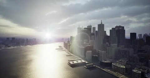 Sunset skyline view of city with river reflecting light and buildings Ilustración de archivo